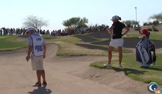Stacy's caddie tests the sand