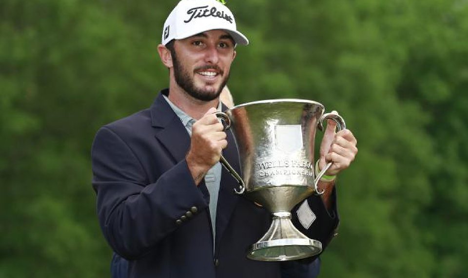 Max Homa hoists the Wells Fargo trophy
