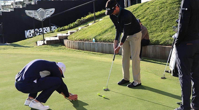 Bryson DeChambeau and Bubba Watson practice putting