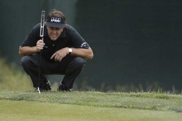 Phil prepares to make another putt