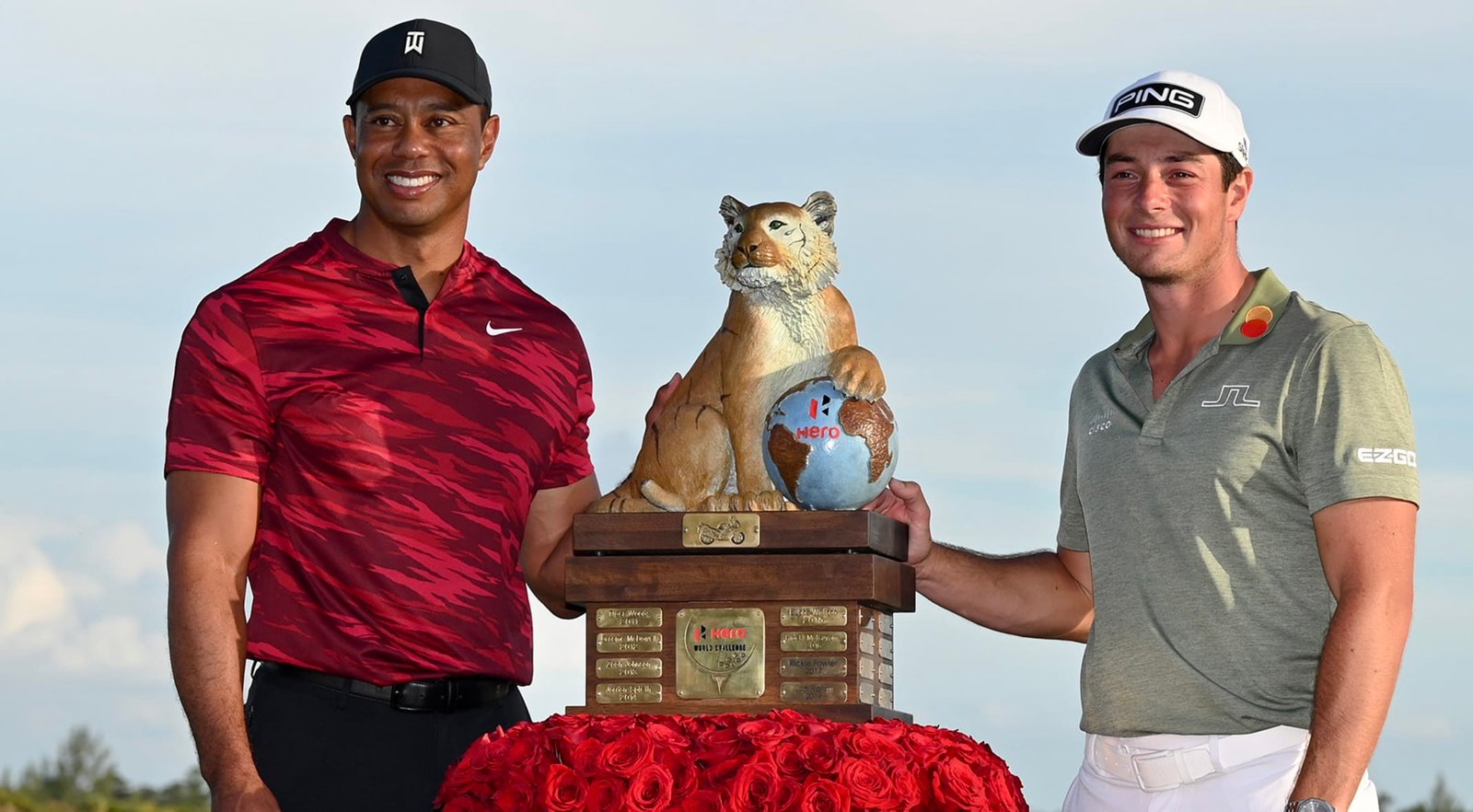 Defending champion Viktor Hovland with Tiger Woods