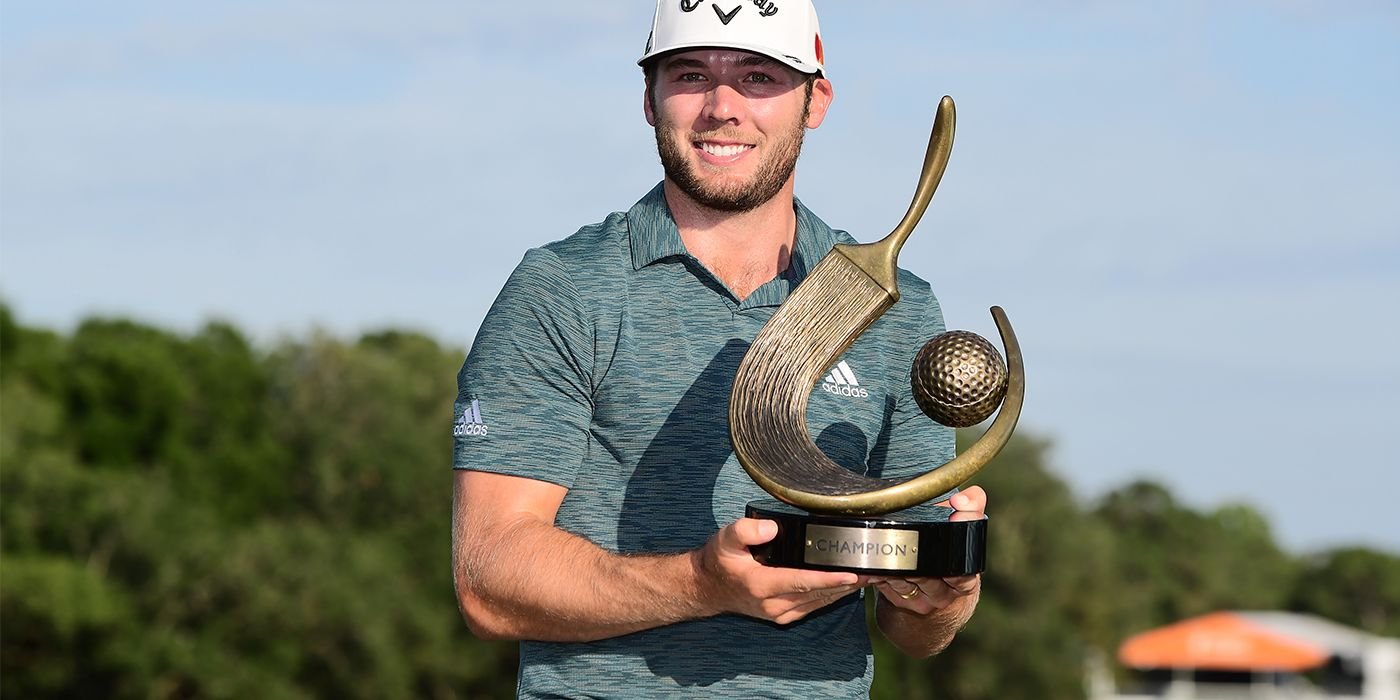 Sam Burns with the Valspar trophy