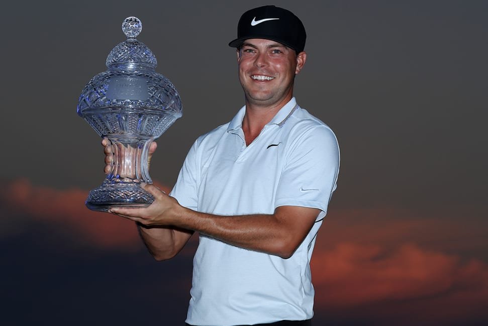Keith Mitchell holding Honda Classic trophy
