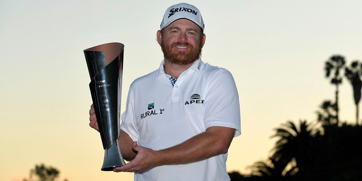 J.B. Holmes with Genesis trophy
