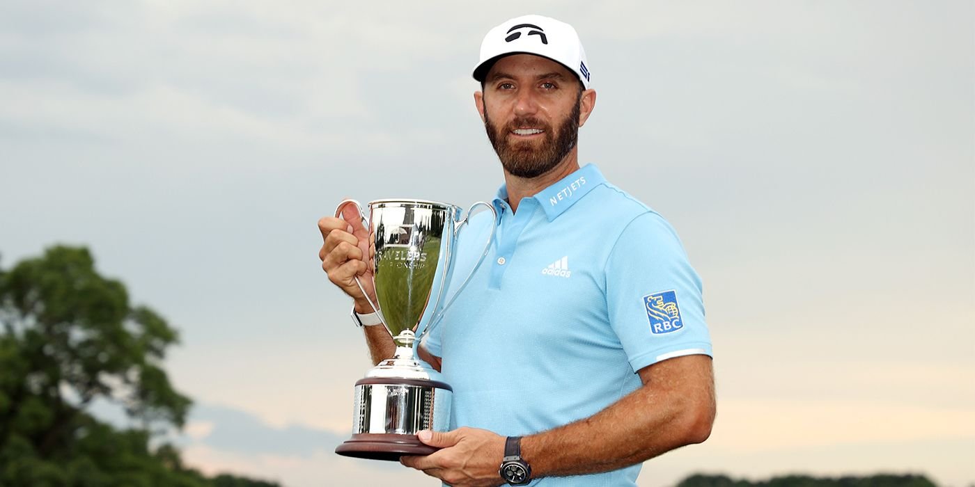 Dustin Johnson holds the Travelers trophy