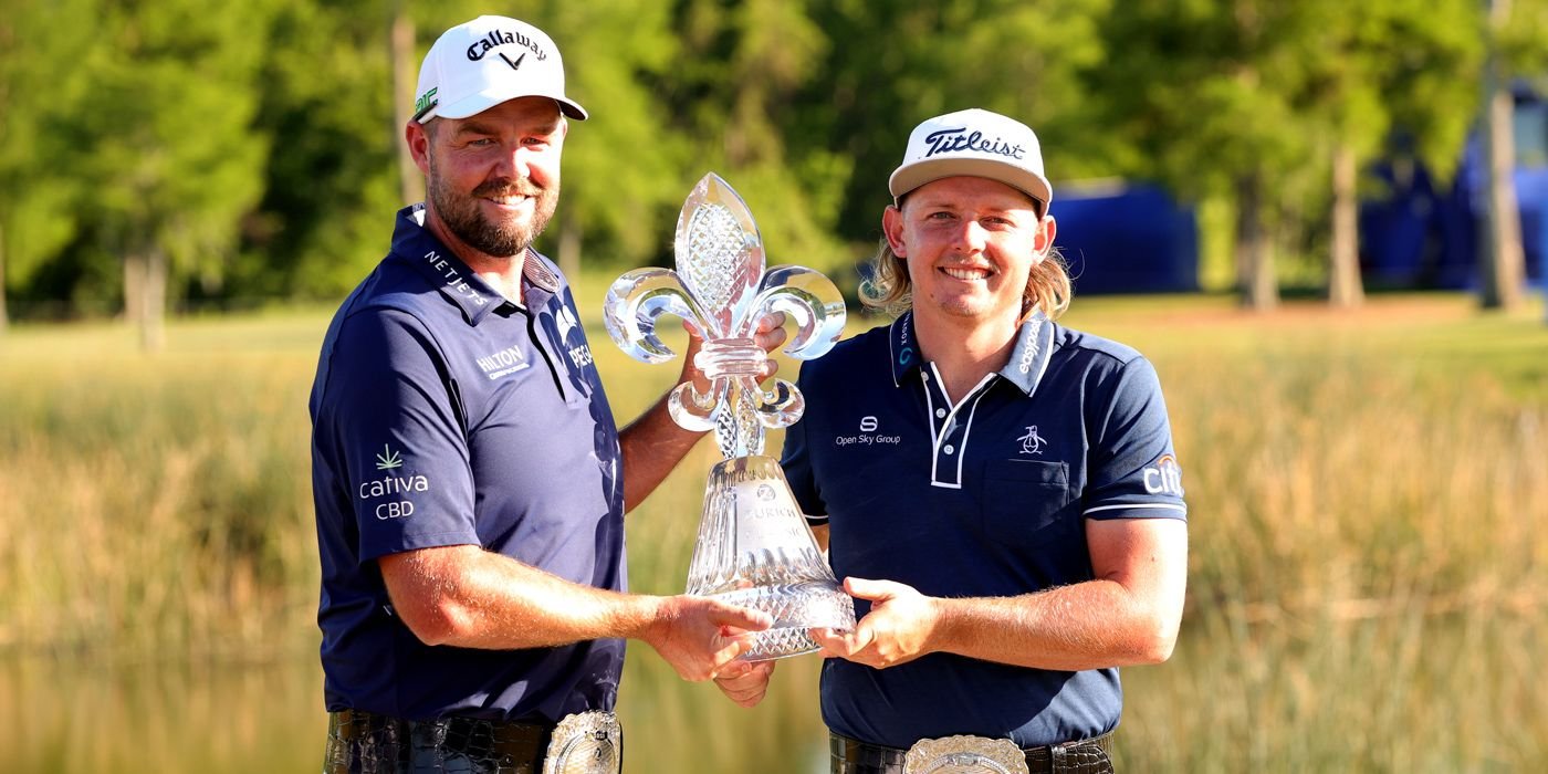 Marc Leishman and Cameron Smith with the Zurich belts and trophy