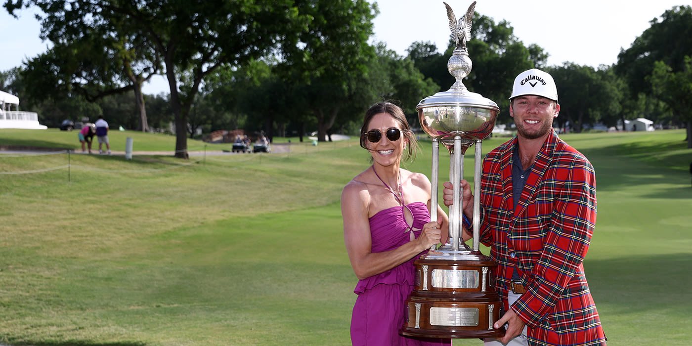 Sam Burns with Schwab trophy and plaid jacket