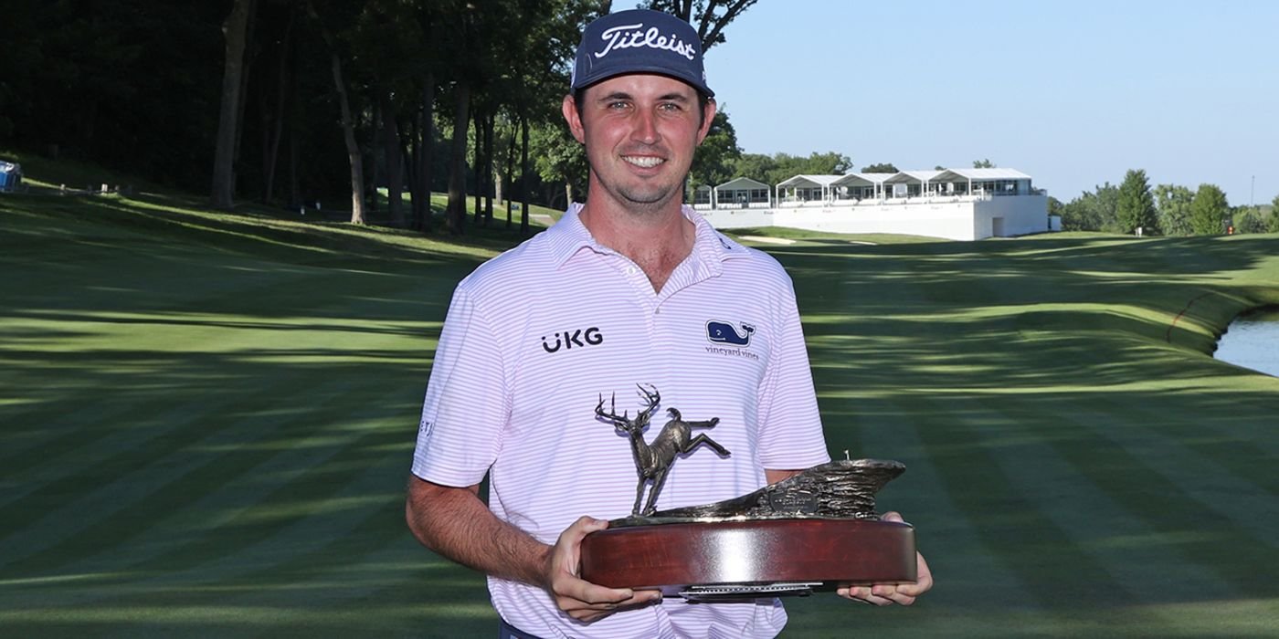 J.T. Poston with John Deere trophy