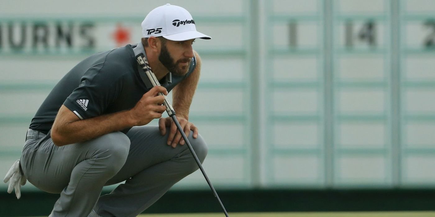 Dustin Johnson reading a putt