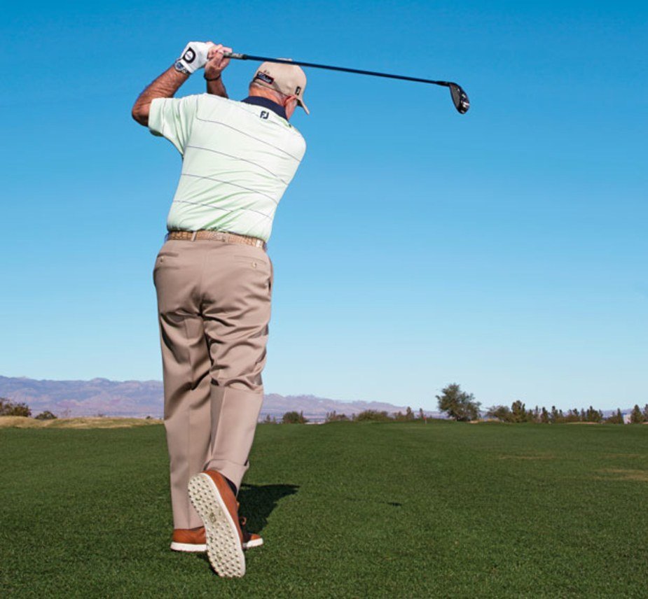 Butch Harmon hitting a 3-wood from the fairway