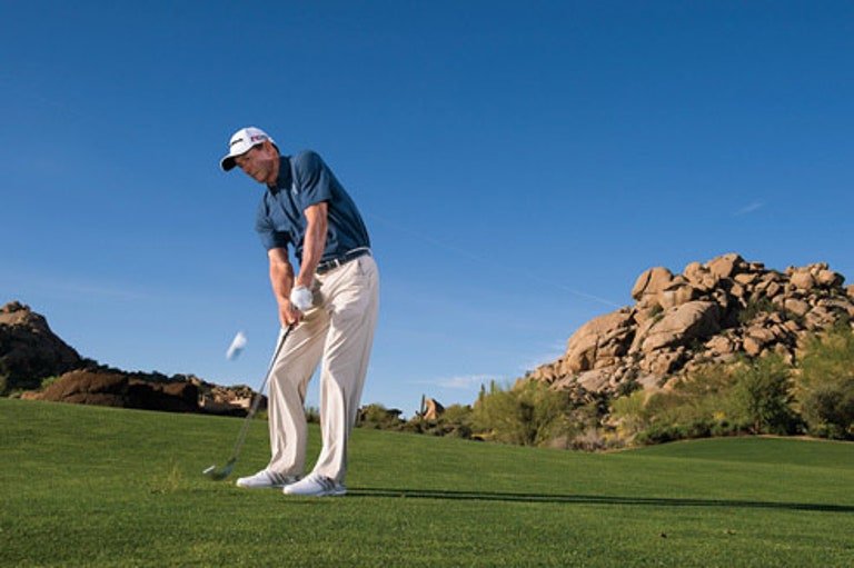 Haney hitting an iron