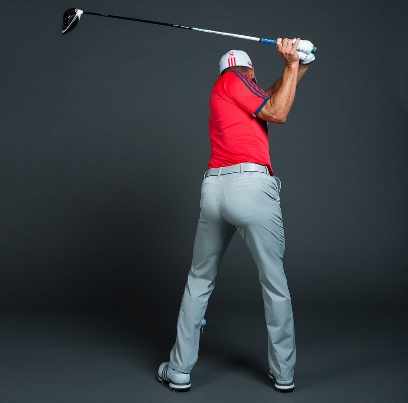 Sergio at the top of his backswing, rear view