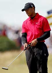 Tiger staring at putter