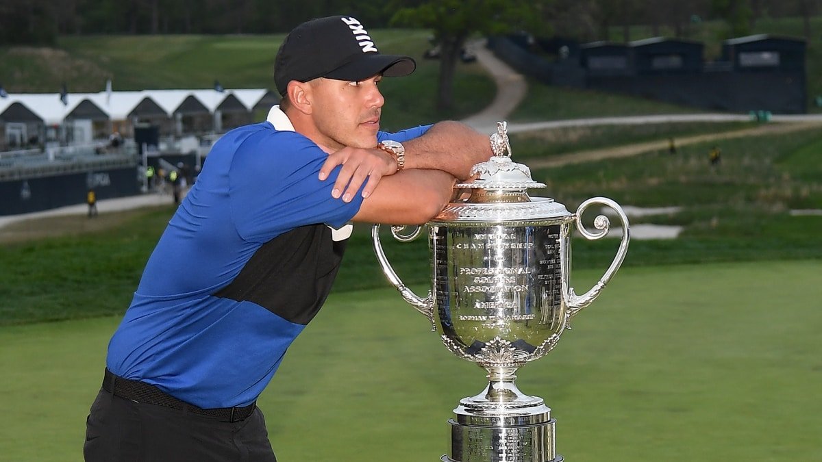 A tired Brooks Koepka with the Wanamaker trophy