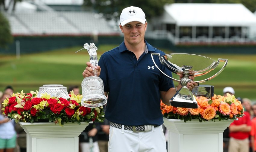 Jordan Spieth with both trophies