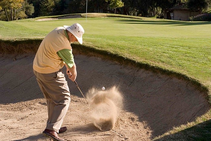 Dave Pelz hitting chunk and run sand shot