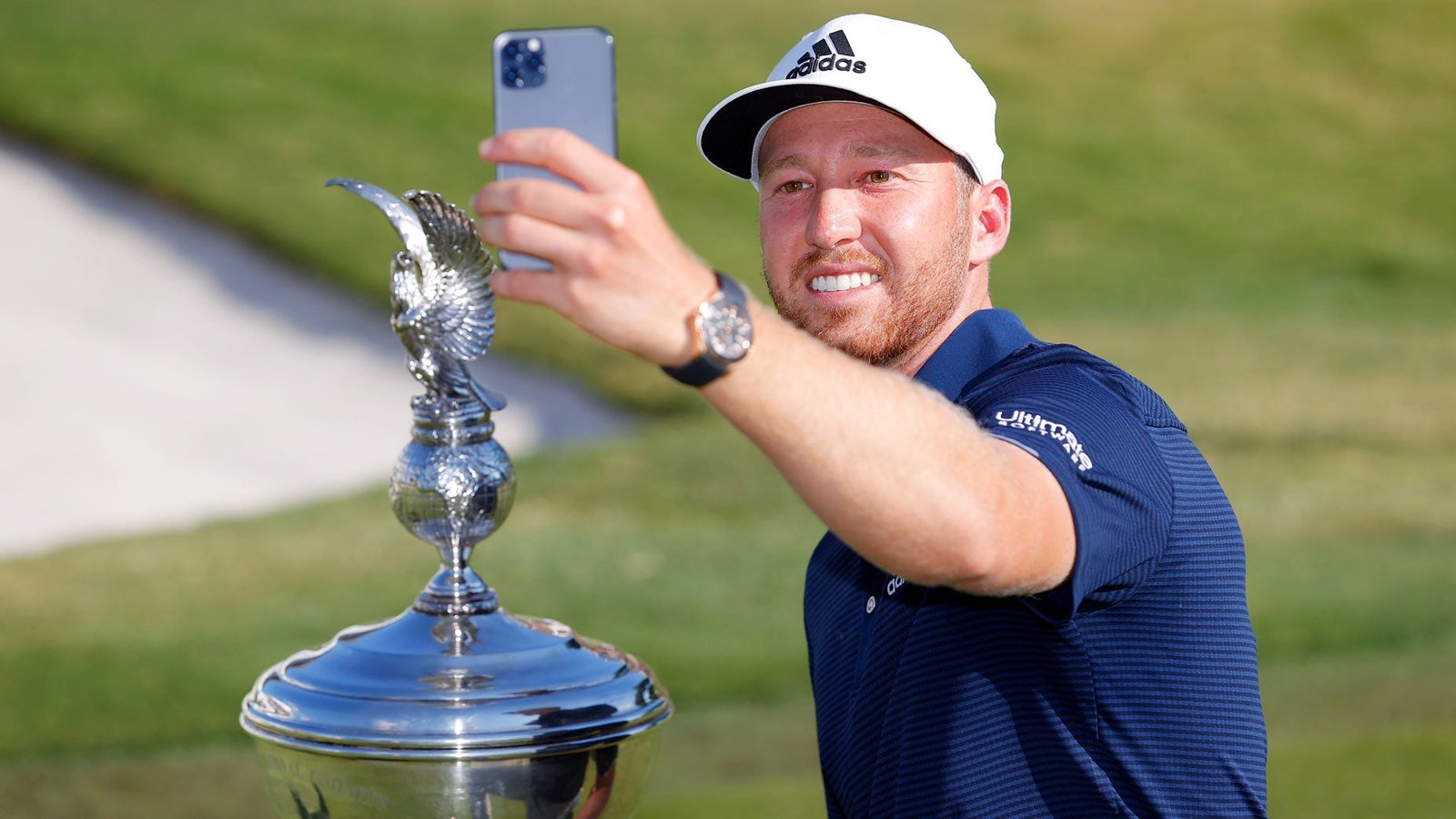 Daniel Berger takes a selfie of himself with the Schwab Challenge trophy